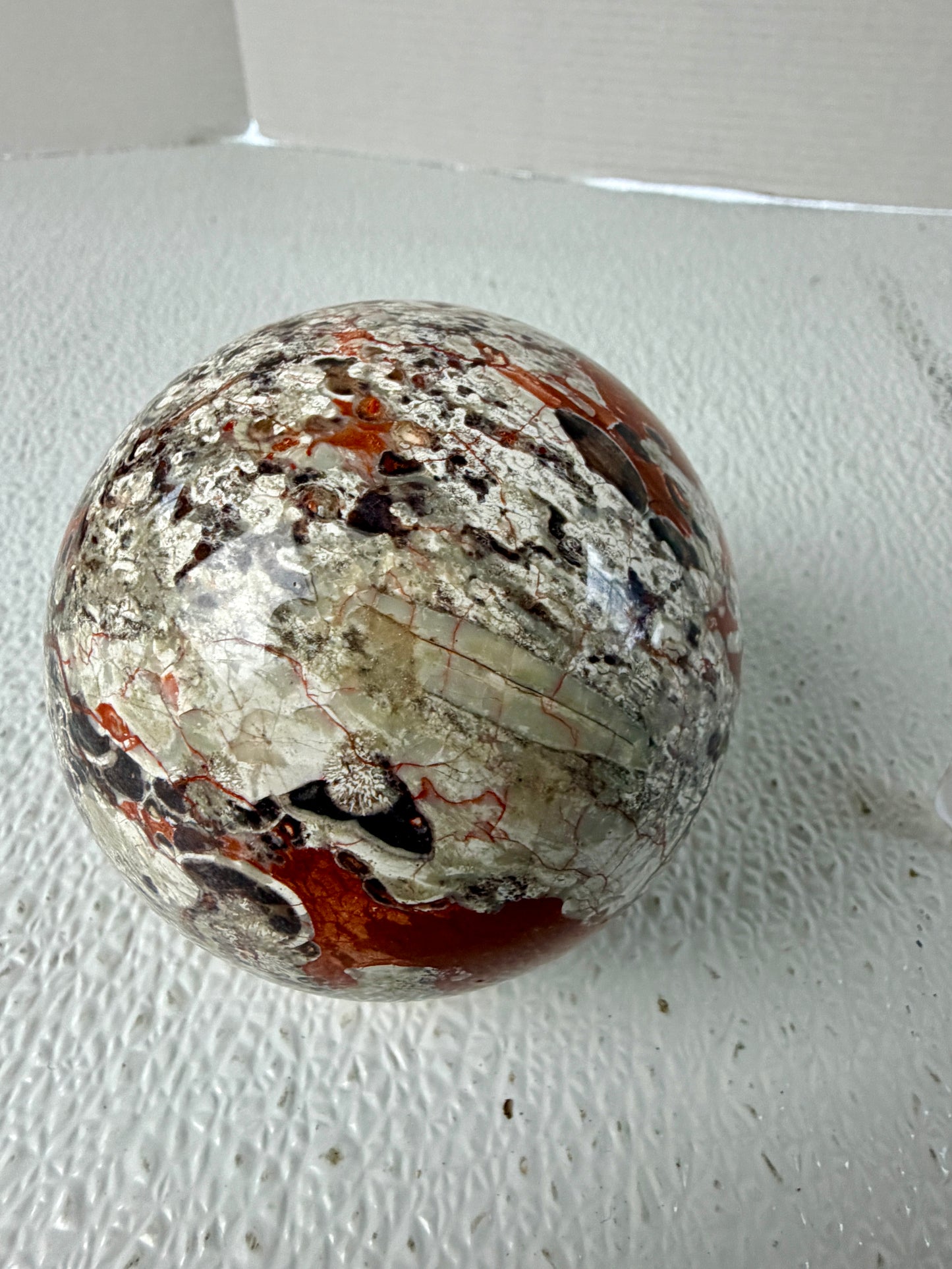 Banded Money Agate Sphere (582g) – Concentric Bullseye Pattern & Fiery Red Agate Banding